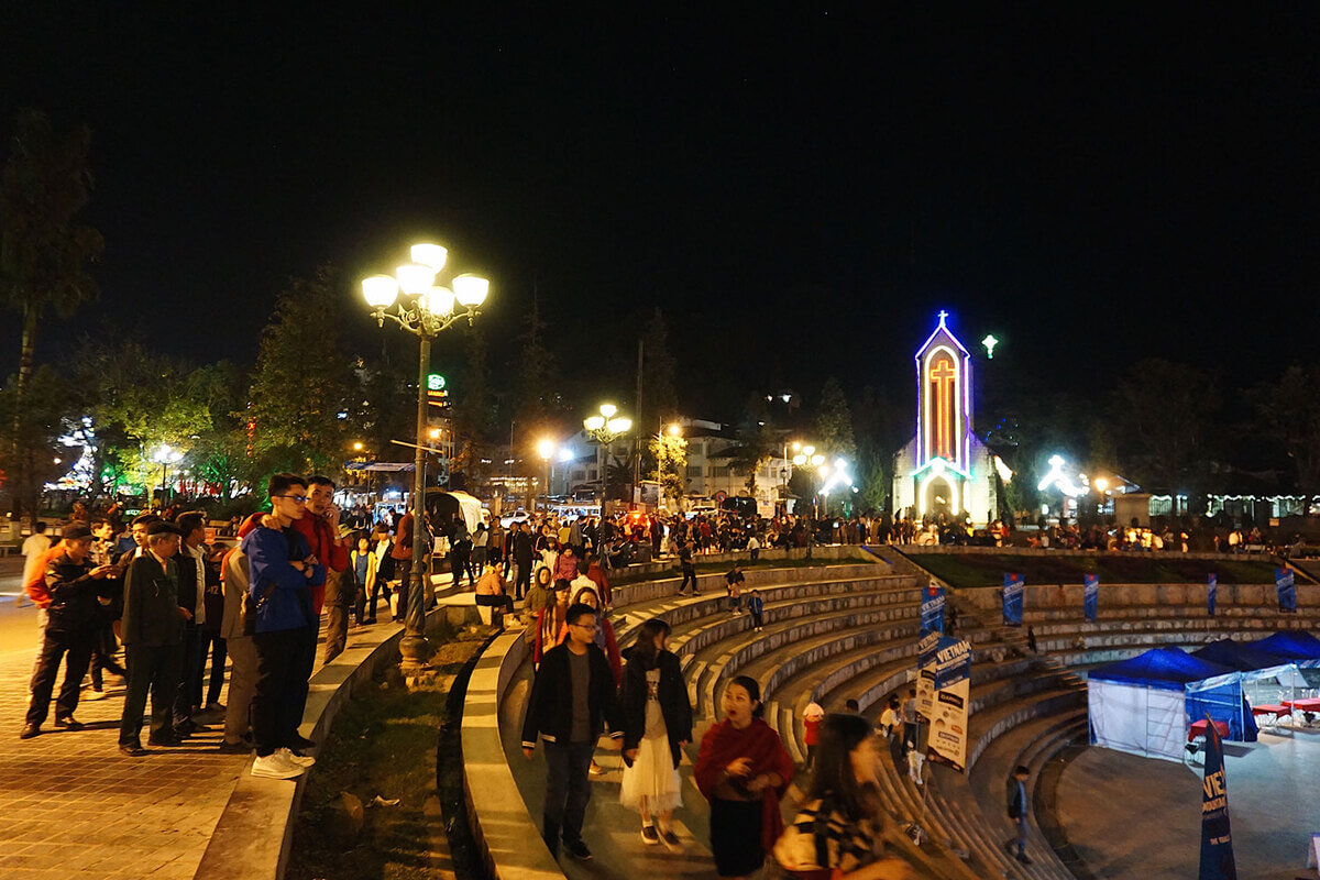 Central square in Sapa illuminated after sunset