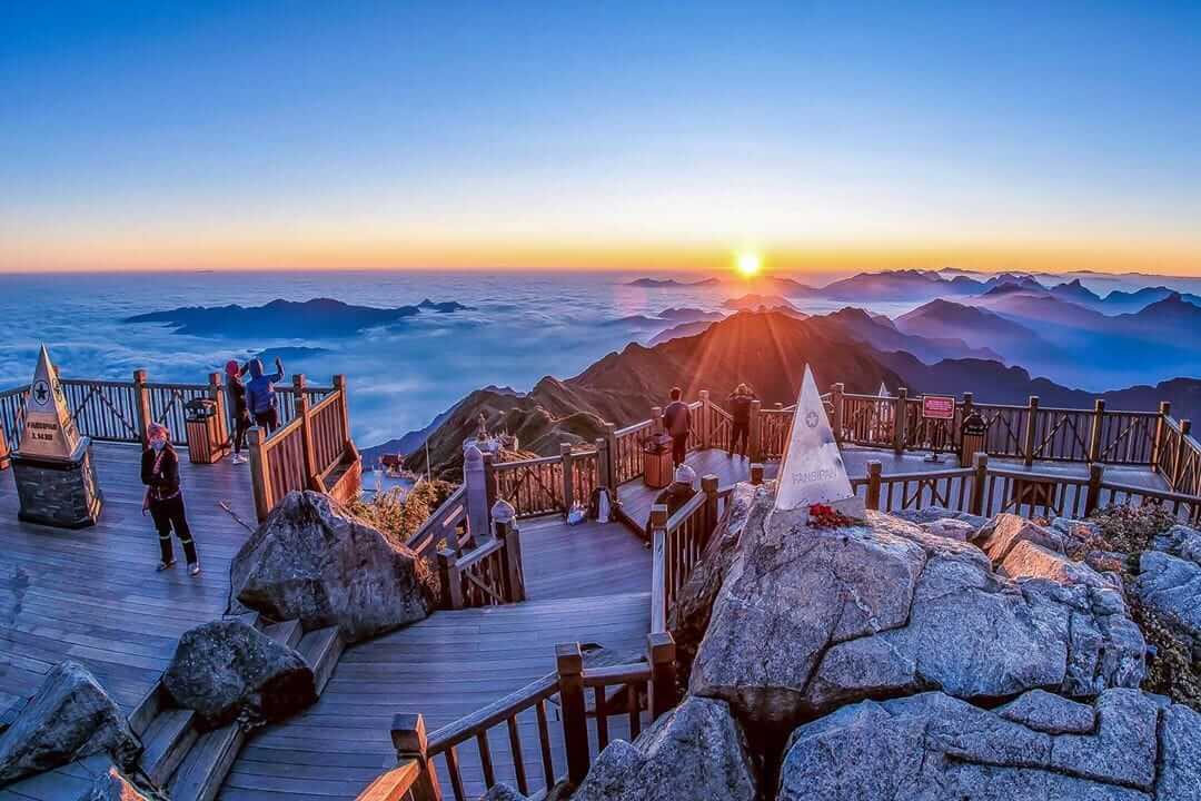 Panoramic view of Fansipan peak rising above the Hoang Lien Son mountain range