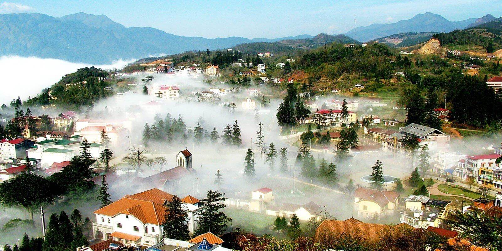 Panoramic view of Sa Pa town with rice terraces and mountains in northern Vietnam