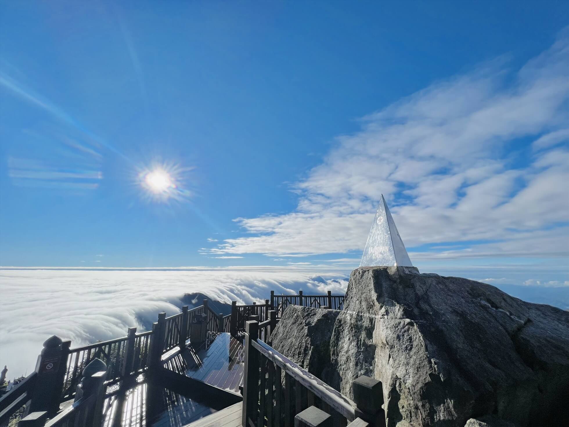 Sea of clouds covering mountain peaks during winter