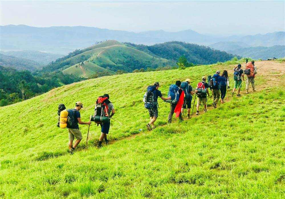 Travelers hiking through scenic terrain