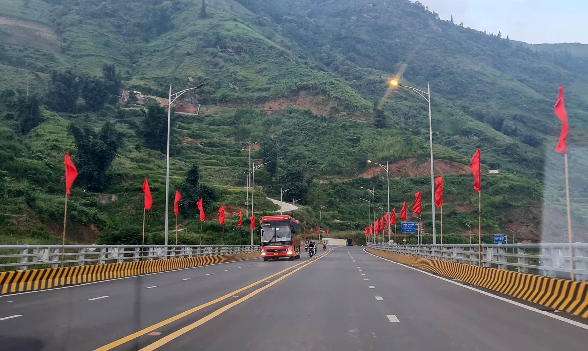 Highway bus traveling through northern Vietnam mountains