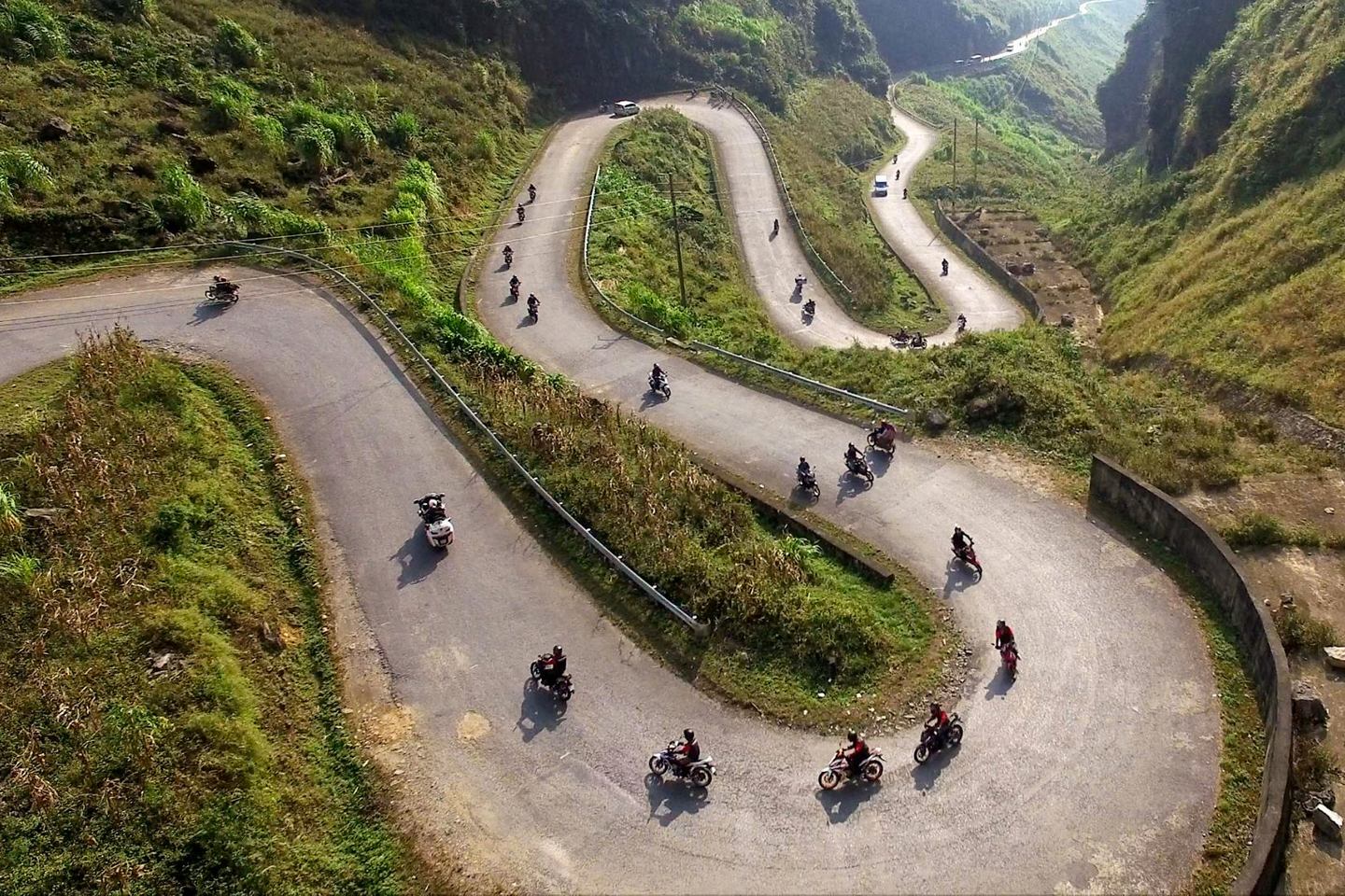 Scenic mountain road from Hanoi to Sapa with misty landscapes
