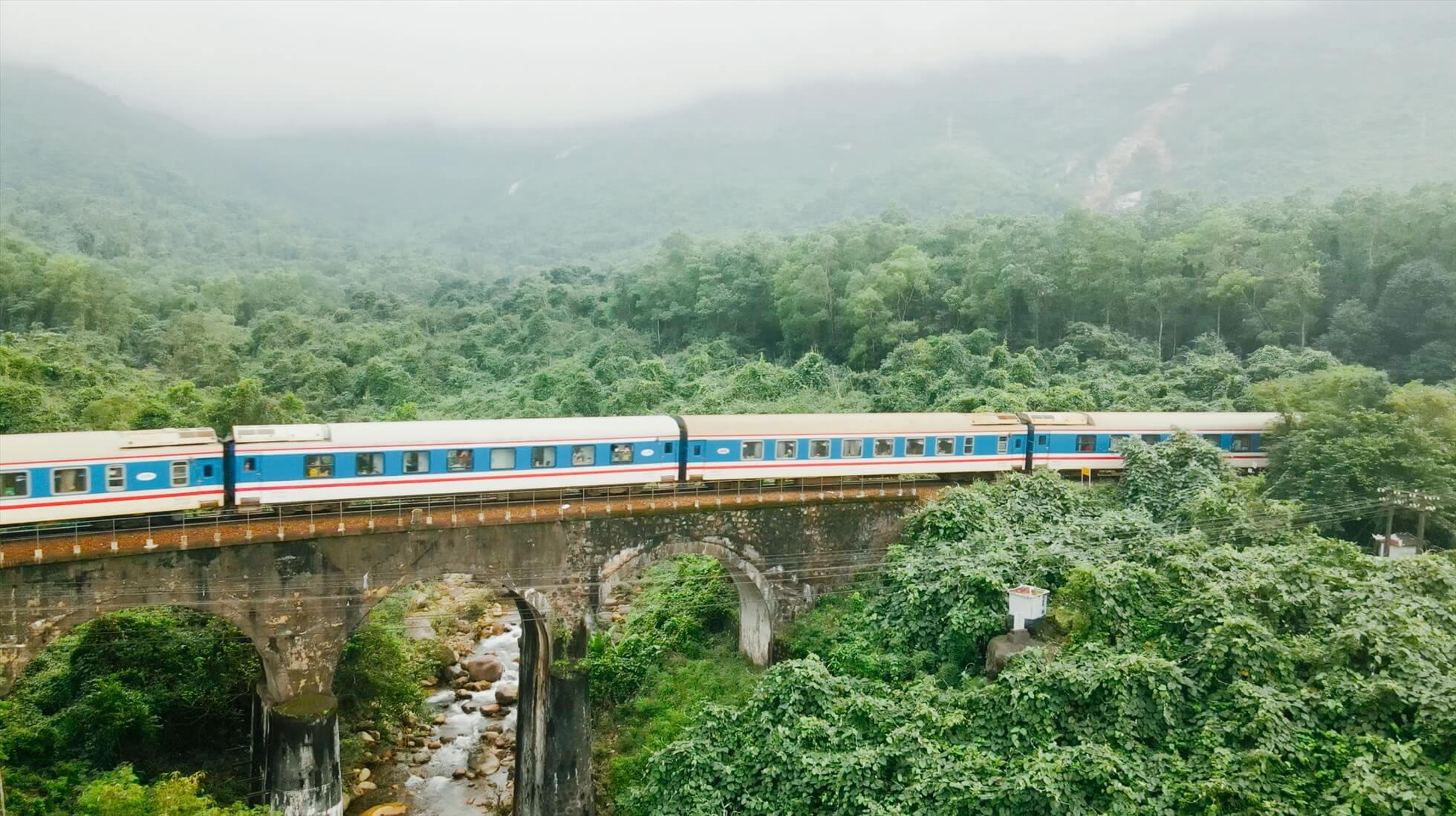 Tourist train traveling through the mountain landscapes of northern Vietnam